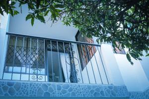 a balcony of a house with a wrought iron fence at Casa Hostal Rico Vacile in Valledupar