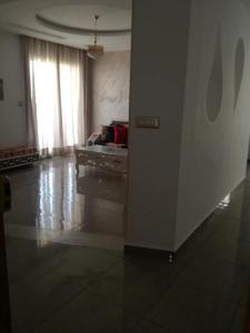 a living room with a couch and a table at s 2 1 km from the beach mansoura kelibia in Kelibia