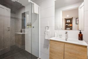 a bathroom with a sink and a shower at Starboard Drift in Margaret River Town +49 photos