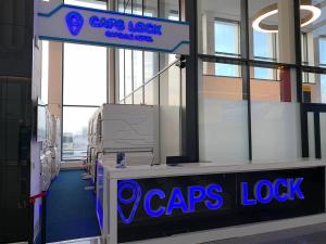 a sign for a crepes lobby in a building at CAPS LOCK Airport Hotel in Astana