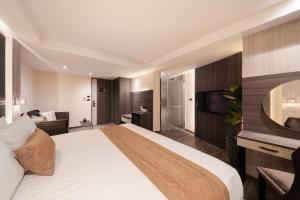 Ein Bett oder Betten in einem Zimmer der Unterkunft Aspira Parc Sukhumvit 22