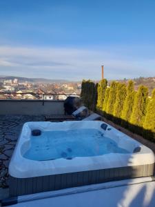 a hot tub on the roof of a house at The Golfer Apartment with Jacuzzi in Cluj-Napoca