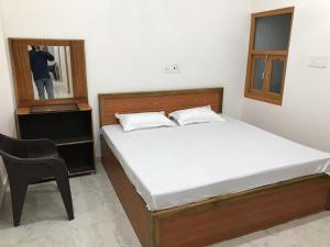 Letto o letti in una camera di Natraj Homes