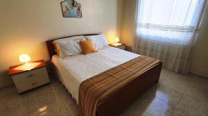 Letto o letti in una camera di Via Ugento Apartments - a pochi passi dalle spiagge