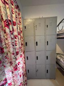 two lockers in a bedroom next to a curtain at Phi Phi Paradise Hostel in Phi Phi Don