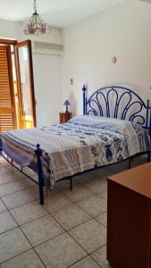 A bed or beds in a room at La Bitta