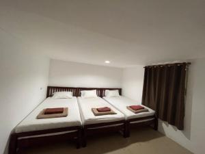 Uma cama ou camas num quarto em Phi Phi Paradise Hostel