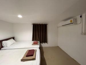Uma cama ou camas num quarto em Phi Phi Paradise Hostel