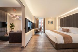 Ein Bett oder Betten in einem Zimmer der Unterkunft Aspira Parc Sukhumvit 22