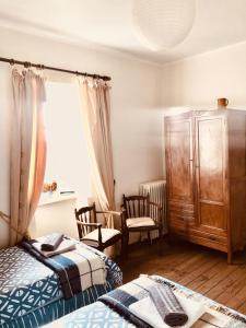 Postel nebo postele na pokoji v ubytování Le Vieux Manoir + 30 fotografií