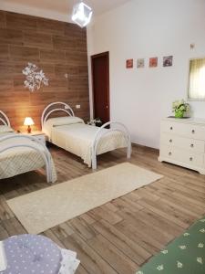 A bed or beds in a room at Monte Granatico