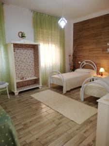 A bed or beds in a room at Monte Granatico