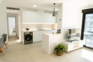 Kuchyňa alebo kuchynka v ubytovaní Apartamento nuevo junto al mar con plaza de garaje!! Perfecto para familias