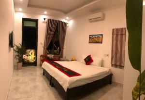 Giường trong phòng chung tại Sunny Garden Homestay