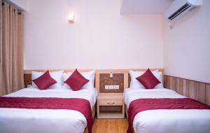 Letto o letti in una camera di Drishya Hotel