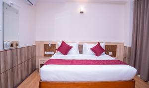 Letto o letti in una camera di Drishya Hotel