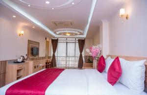 Letto o letti in una camera di Drishya Hotel