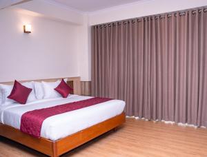 Letto o letti in una camera di Drishya Hotel