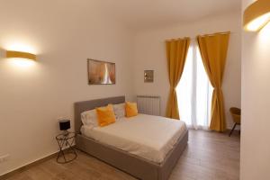 Ліжко або ліжка в номері Aragona15 Suites