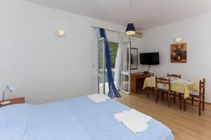 Postel nebo postele na pokoji v ubytování Apartments Posta