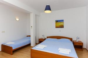 Postel nebo postele na pokoji v ubytování Apartments Posta