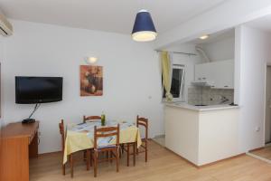 Kuchyň nebo kuchyňský kout v ubytování Apartments Posta