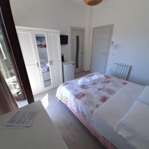Postel nebo postele na pokoji v ubytování B&B La Carminella