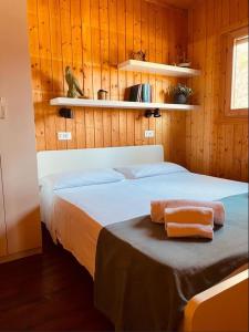 Llit o llits en una habitació de Le Dune Villaggio