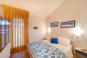 En eller flere senge i et værelse på Villaggio Club dei Pini