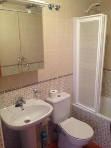 a bathroom with a toilet and a sink at AZ02 Roof top terrace apartment, 2 bedrooms, 1 bathroom, very close to beach in La Azohía