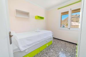 A bed or beds in a room at Seafront Apartment Voramar 31