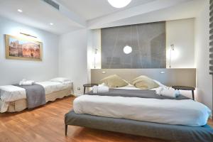 Postel nebo postele na pokoji v ubytování belMORO - La Dimora Del Capo