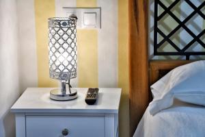 A bed or beds in a room at WonderStays Apartamentos Maribel