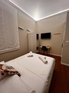 Postel nebo postele na pokoji v ubytování B&B TIVÌTTI
