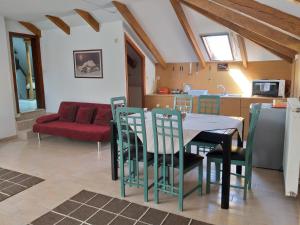 a kitchen and living room with a table and chairs at ALLEGRO HOME in Néon Bizánion
