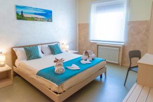Postel nebo postele na pokoji v ubytování Affittacamere Bardolino