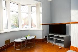 TV i/ili multimedijalni sistem u objektu Alexander Apartments Northumberland