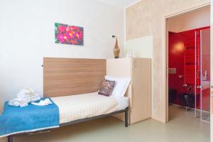 Postel nebo postele na pokoji v ubytování Affittacamere Bardolino