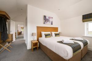 Ένα ή περισσότερα κρεβάτια σε δωμάτιο στο Elderburn Lodges