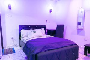 Postel nebo postele na pokoji v ubytování Easyinn Shortlet Apartment