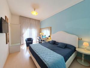 Postel nebo postele na pokoji v ubytování Hotel Continentale