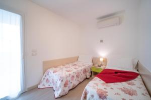 Postel nebo postele na pokoji v ubytování Residenza Monica