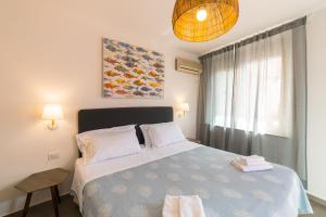 Tempat tidur dalam kamar di Hotel Villino Gallodoro