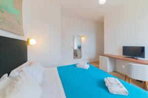 Cama ou camas em um quarto em Hotel Villino Gallodoro