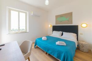 Cama ou camas em um quarto em Hotel Villino Gallodoro