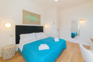 Cama ou camas em um quarto em Hotel Villino Gallodoro