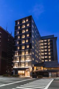 a tall black building with many windows at Sotetsu Fresa Inn Kyoto-Kiyomizu Gojo in Kyoto