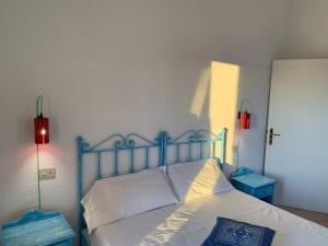 Ein Bett oder Betten in einem Zimmer der Unterkunft Godo Beach Hotel