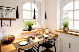 a kitchen with a wooden table with fruit on it at Am Rosenhain 14 Am Rosenhain 14 Appartement 3 in Timmendorfer Strand