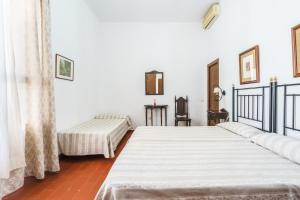 Postel nebo postele na pokoji v ubytování Hotel Marqués de Torresoto by Vivere Stays